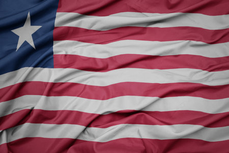 waving colorful national flag of liberia. macro shot