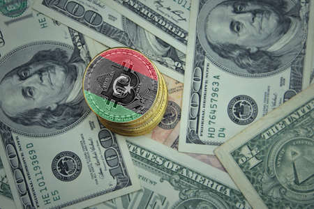 golden shining bitcoins with flag of libya on a dollar money background. bitcoin mining concept.の写真素材