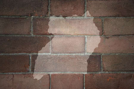 painted map of uganda on a old brick wallの写真素材