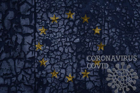 flag of european union on a old vintage metal rusty cracked wall with text coronavirus, covid, and virus picture.の写真素材