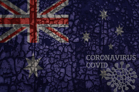 flag of australia on a old vintage metal rusty cracked wall with text coronavirus, covid, and virus picture.の写真素材