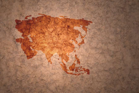 map of asia on a old ancient vintage crack paper backgroundの写真素材