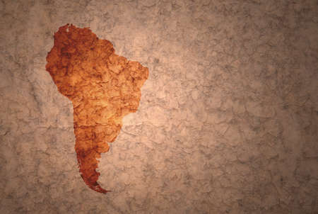 map of south america on a old ancient vintage crack paper backgroundの写真素材