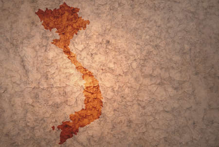 map of vietnam on a old ancient vintage crack paper backgroundの写真素材