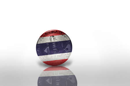 bitcoin with the national flag of thailand on the white background. bitcoin mining concept. 3d illustrationの写真素材