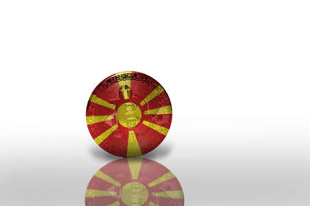bitcoin with the national flag of macedonia on the white background. bitcoin mining concept. 3d illustrationの写真素材