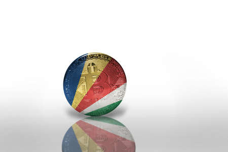bitcoin with the national flag of seychelles on the white background. bitcoin mining concept. 3d illustrationの写真素材
