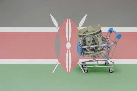 Metal shopping basket with big dollar money banknote on the national flag of kenya background. consumer basket concept. 3d illustrationの写真素材