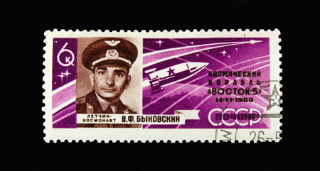 Old Soviet postage stamp with Cosmonaut on black backgroundの写真素材