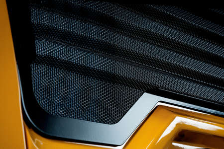 Yellow front panel of a car tractor mechanism machine. Industry technologies, driveの写真素材