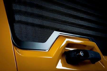 Yellow front panel of a car tractor mechanism machine. Industry technologies, driveの写真素材