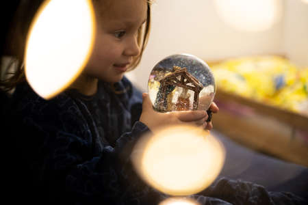 Christmas boy dreams of evening childhood tree holiday flashlightsの写真素材