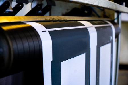 A industrial commercial envelope making machine, making paper envelopes for international...