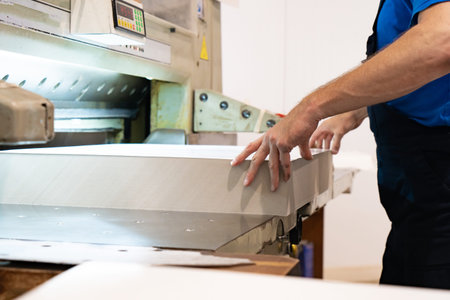 close up engineer hand finger press button controling cnc machine, Workers operating factory...