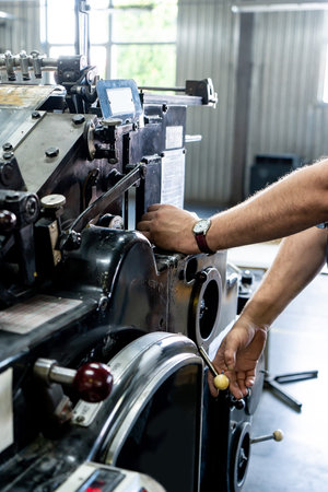 close up engineer hand finger press button controling cnc machine, Workers operating factory...