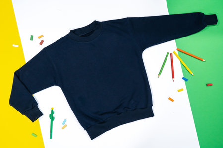 Boy's sweatshirt design with long raglan sleeves in black navy blue color, flat sketch, front and...