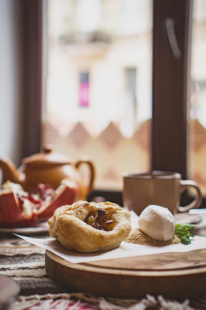 Traditional Georgian sweets and desserts with hazelnuts, walnuts, grape juice, honey, chocolate. Baklava, nakhini, Fresh fruits and candied fruits. Traditional Turkish coffee.の写真素材