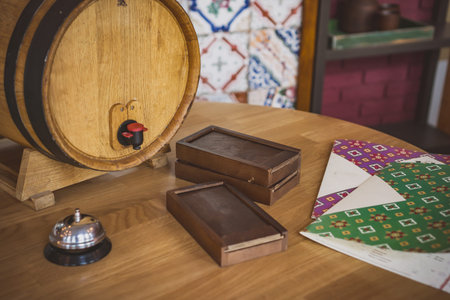 Expensive wine bottle and wooden barrel in restaurant, wine tasting