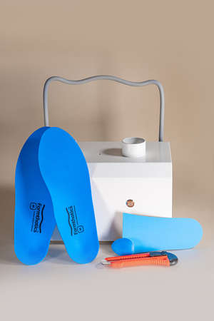 Orthopedic insoles for shoes on a color backgroundの写真素材