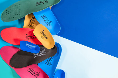 Orthopedic insoles for shoes on a color backgroundの写真素材