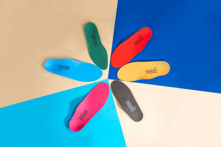 Orthopedic insoles for shoes on a color backgroundの写真素材