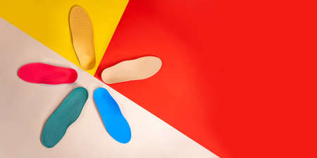 Orthopedic insoles for shoes on a color backgroundの写真素材
