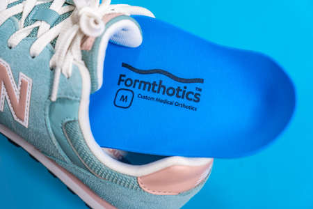Orthopedic insoles for shoes on a color backgroundの写真素材