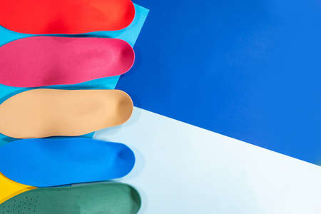 Orthopedic insoles for shoes on a color backgroundの写真素材