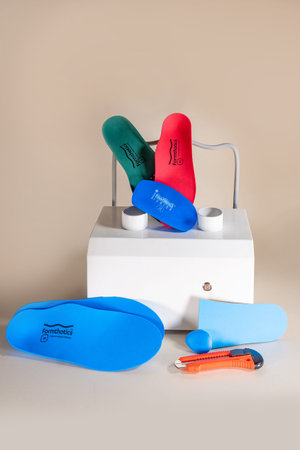 Orthopedic insoles for shoes on a color backgroundの写真素材