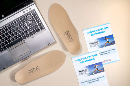 Orthopedic insoles for shoes on a color backgroundの写真素材