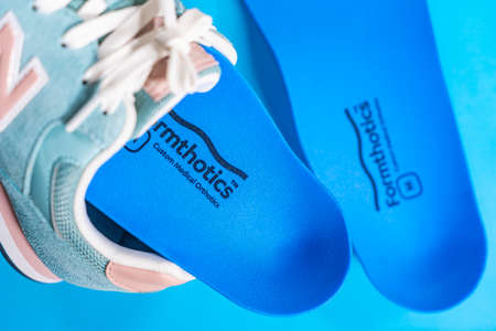 Orthopedic insoles for shoes on a color backgroundの写真素材