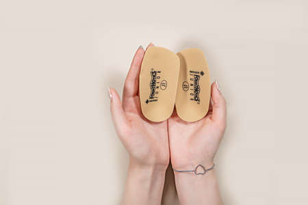 Orthopedic insoles for shoes on a color backgroundの写真素材