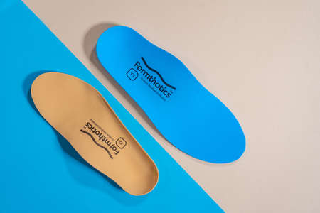 Orthopedic insoles for shoes on a color backgroundの写真素材