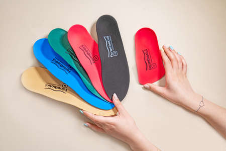 Orthopedic insoles for shoes on a color backgroundの写真素材