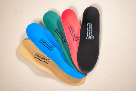 Orthopedic insoles for shoes on a color backgroundの写真素材