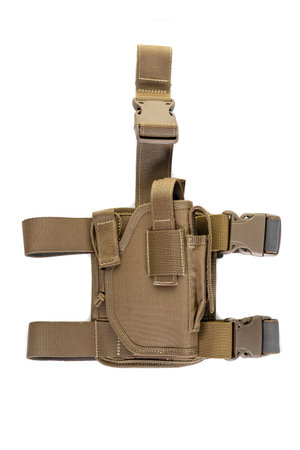 Holster hanging on soldier's leg. Leg holder for gun. Isolated military tacticalの写真素材