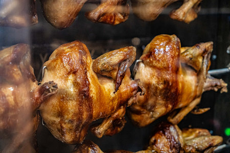 Grilled chickens in spinning rollsの写真素材