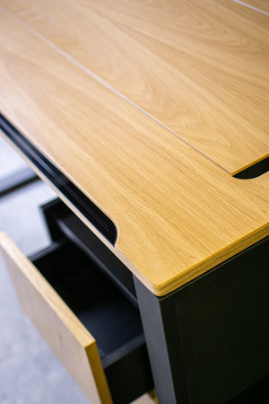 Empty rough wooden table top in dark roomの写真素材