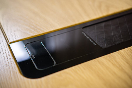 Mobile phone with wireless charger table. Modern workplace accessory