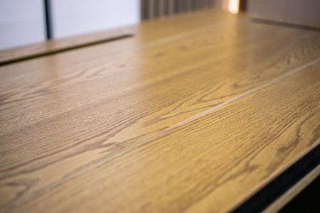Empty rough wooden table top in dark roomの写真素材