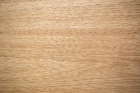 Empty rough wooden table top in dark roomの写真素材