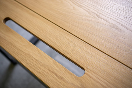 Empty rough wooden table top in dark room
