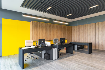 Modern office space with tables and chairs, computers and office supplies no employeesの写真素材