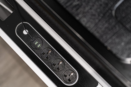Mobile phone with wireless charger table. Modern workplace accessoryの写真素材