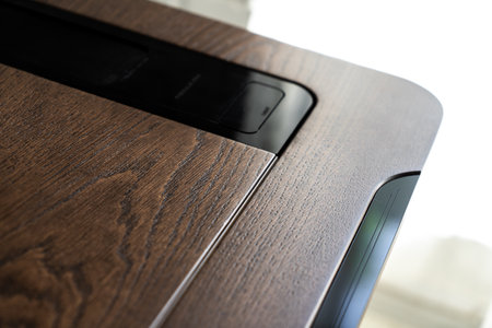 Mobile phone with wireless charger table. Modern workplace accessoryの写真素材