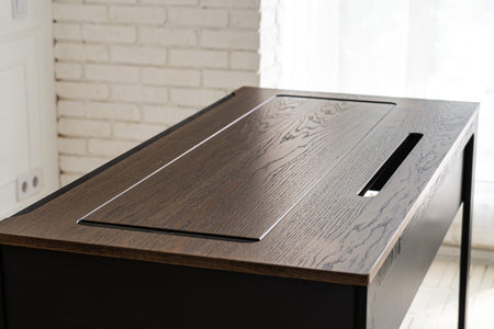 Mobile phone with wireless charger table. Modern workplace accessory