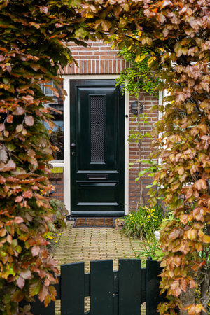 Typical Dutch door. Dutch holland architectural detail, a door in Netherlands city. Dutch doorの写真素材