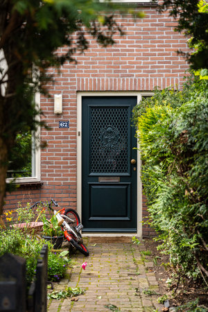 Typical Dutch door. Dutch holland architectural detail, a door in Netherlands city. Dutch doorの写真素材