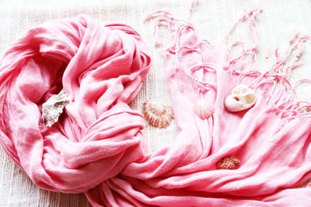 pink natural fibre scarf with found shellsの写真素材