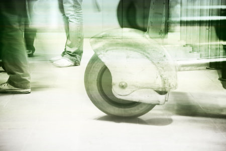 a shot of people's feet as they wait and walk through an airport - green and blue finish with subtle  stripesの写真素材